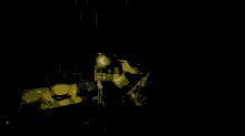 a dark room with a few lights and a few boxes on the floor