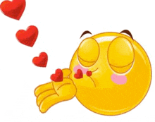 a yellow smiley face is blowing a kiss with red hearts flying around it .