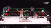 wrestlers in a ring with a youtube logo in the corner