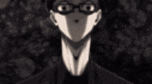 a close up of a man 's face with glasses and a suit .