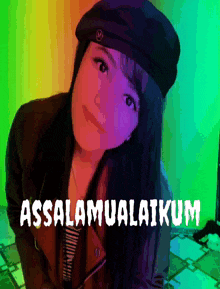 a woman wearing a black hat with the words assalamualaikum written on it