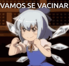 a girl in a blue dress is flexing her muscles in front of a sign that says vamos se vacinar