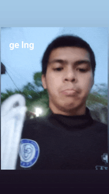 a blurry picture of a man with the words " ge ing " above him