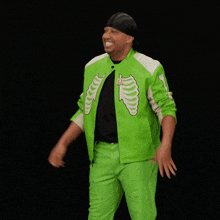 a man is wearing a green jacket with a skeleton on it