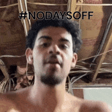 a shirtless man says #nodaysoff in front of a ceiling with insulation