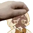 a person is petting a cartoon character 's face with their hand .