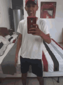 a man is taking a picture of himself with his phone