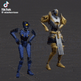 a blue robot and a gold robot are dancing together .