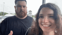 a man and a woman are posing for a picture