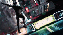a man is flying through the air in a city .