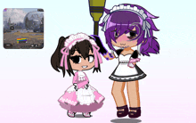 a girl with purple hair is holding a broom next to another girl