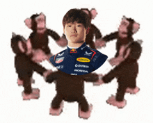 monkeys are dancing around a man wearing a red bull shirt