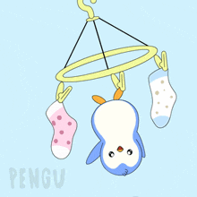 a penguin is hanging upside down on a clothesline