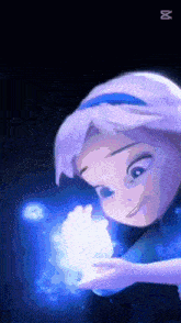 a little girl with purple hair is smiling and holding a blue object