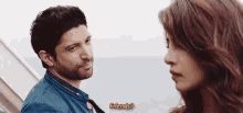 a man and a woman are looking at each other and the woman is asking the man if he is friends .
