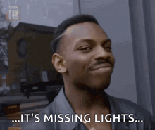 a man says it 's missing lights while smiling