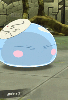a blue cartoon character with a white circle on his head and a pink nose