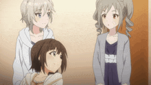three anime girls are standing next to each other and one is wearing a white hoodie