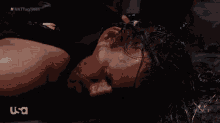 a man laying on the ground with a shirt that says ' king of the ring ' on it