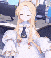 a girl in a white dress and tie is sitting at a desk