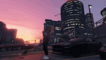a woman stands in front of a black car in a city with a sunset in the background