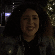 a woman is making a funny face in front of a sign that says subway
