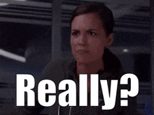 a woman with a ponytail is making a funny face and says really ?