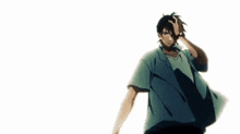 a man in a blue shirt is holding a gun in his right hand