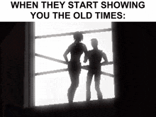 when they start showing you the old times : a couple standing in front of a window