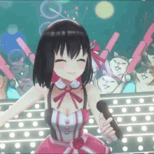 a girl in a pink dress is singing into a microphone on stage
