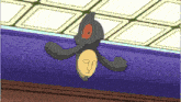 a cartoon character is flying over a purple wall with a yellow object in its mouth .