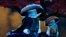 two lego figures standing next to each other with one wearing a hat