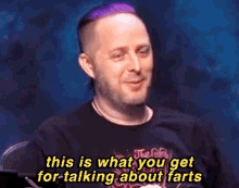 a man with purple hair is talking about farts