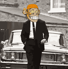 a man in a suit and tie with a monkey mask on his head