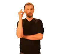 a man in a black shirt is pointing up
