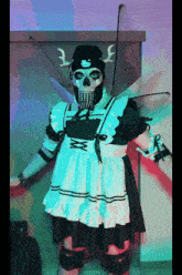 a skeleton dressed as a maid with wings and a knife