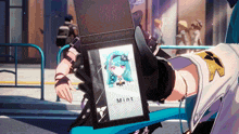 a person is holding a wallet that says mint