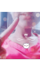 a woman in a pink shirt is giving a peace sign with a crown on her neck
