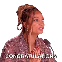 a woman with dreadlocks praying in front of a microphone with the words congratulations written below her