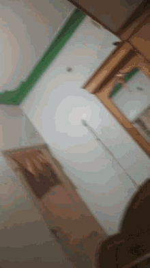 a blurry picture of a ceiling with a picture on the wall