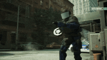 a police officer is walking down a street with a beta footage sign above him