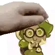 a cartoon character wearing glasses and a backpack is being propped up by a hand .