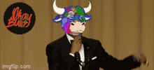 a picture of a man in a tuxedo with a bull mask on his face