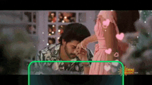 a man is kissing a woman 's hand in a video .