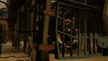 a man is standing in a cage with a sword in his hand .