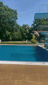 a person is jumping into a swimming pool