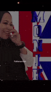 a woman is standing in front of a british flag with the words " lalat jatuh ke dalam air putih maka airnya dibui "