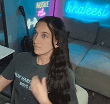 a woman is wearing a t-shirt that says how hard boys do