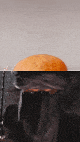 a tiktok video shows a person holding a donut in a glass