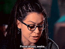 a woman with dreadlocks and glasses says proud of you , sestra .